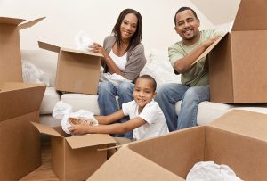 Image of family with moving boxes