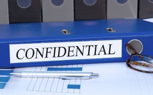 Image of a binder with a label that says confidential